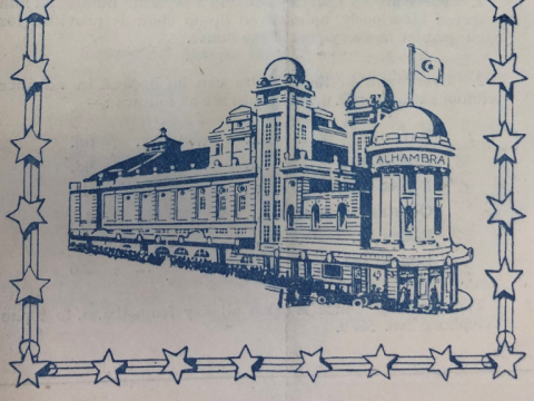 A blue sketch of the Alhambra Theatre on white paper with a border of stars around the edge. It shows the Alhambra Theatre from Great Horton Road.